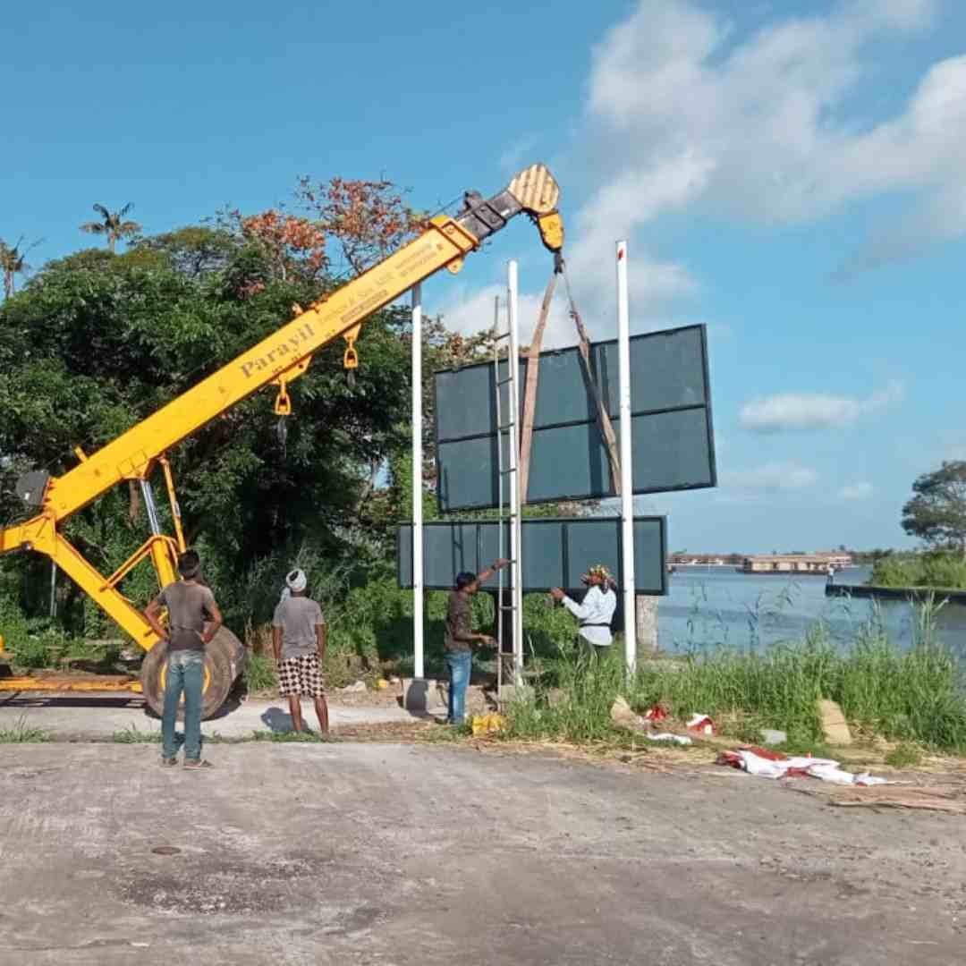 Lifting a sign board into place