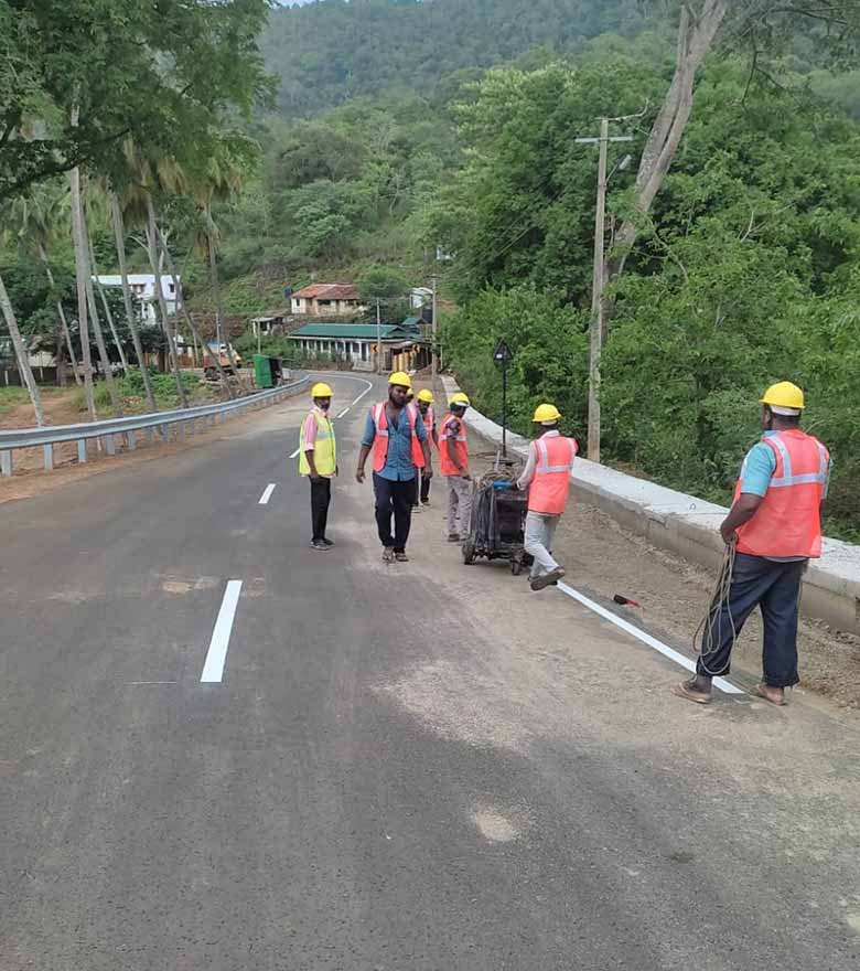 Marking crew on a hill road